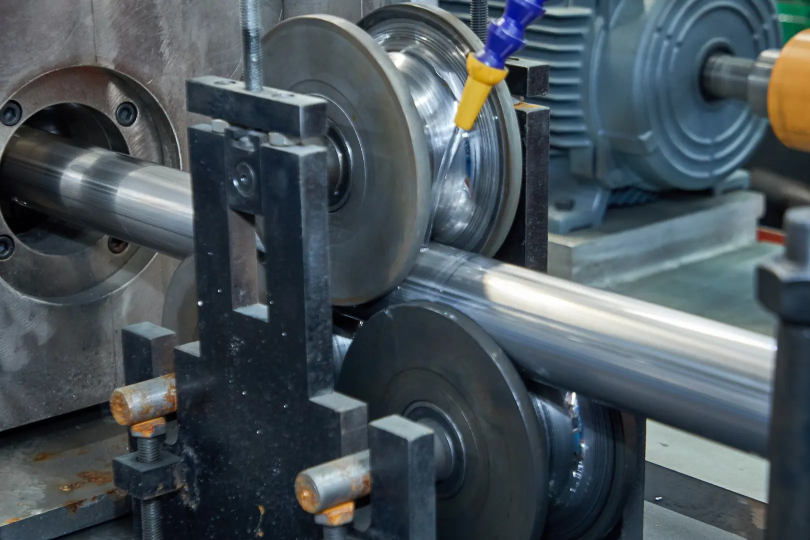 Close-up view of stainless steel tube being precisely machined in an industrial setting