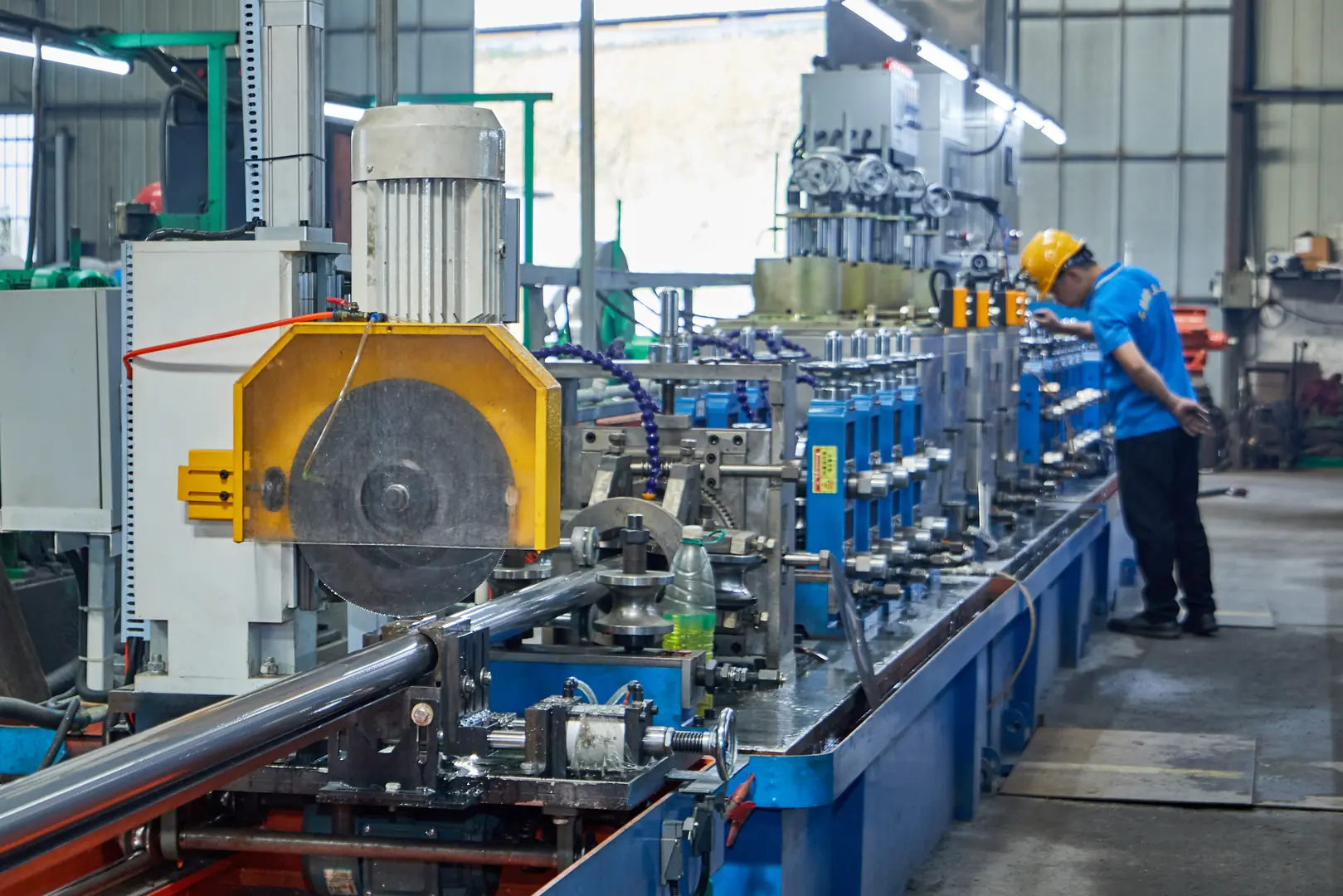 Industrial pipe manufacturing machine with high-speed precision capabilities in a factory setting